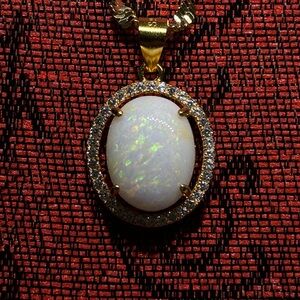 Majestic Rare Lambina Opal Set In an Upscale Setting Hung By A Singapore Chain